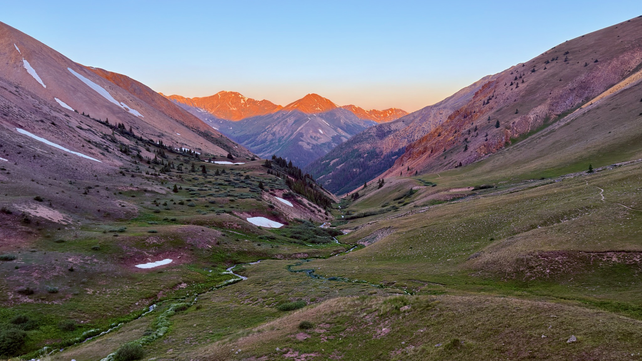 Alpine mountain valley at sunset